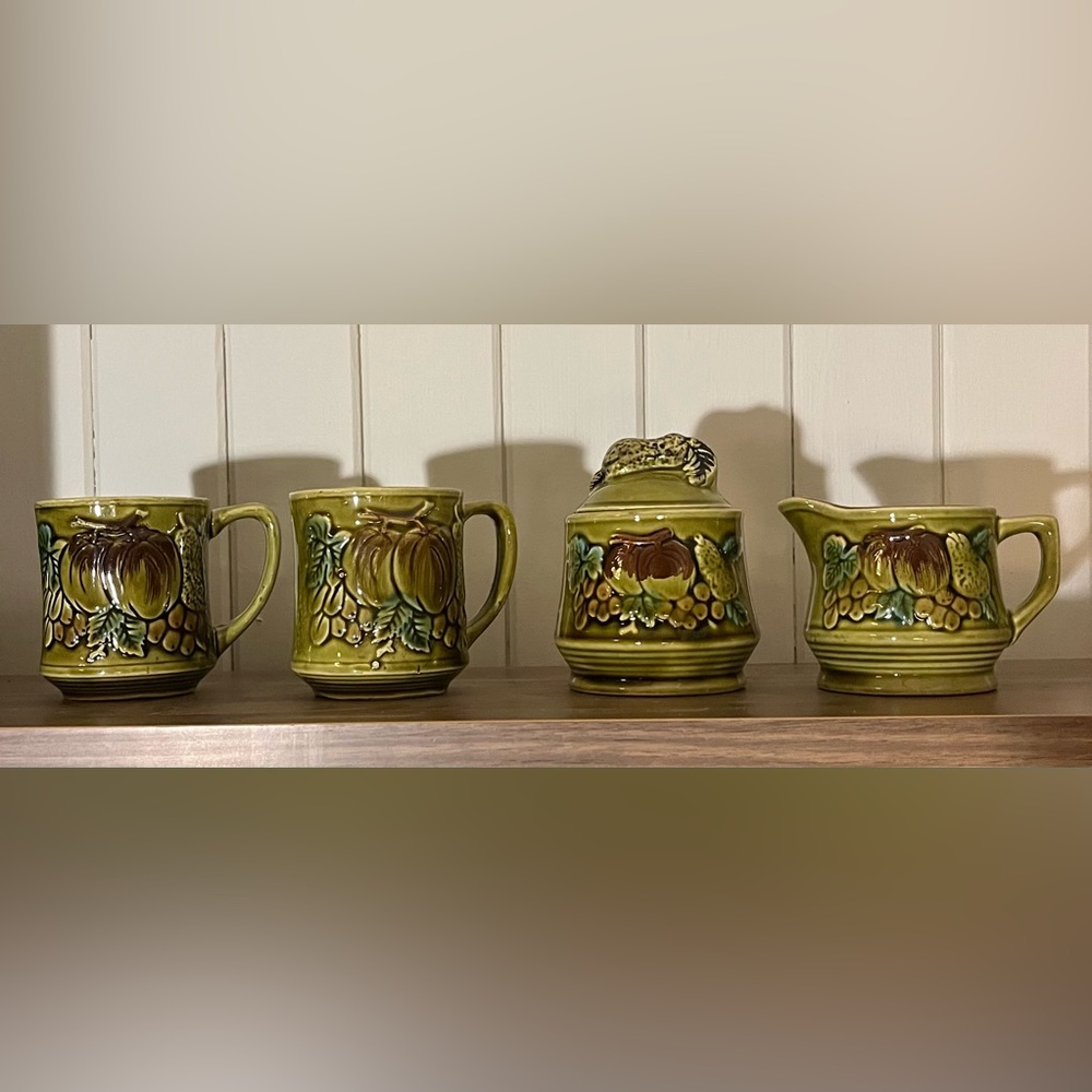 Cute mugs with creamer and sugar jar